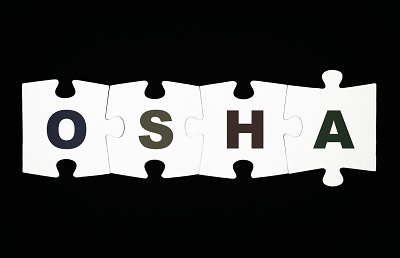 Puzzle pieces spelling OSHA